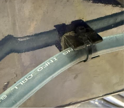 Cooling line bracket installed on MR26